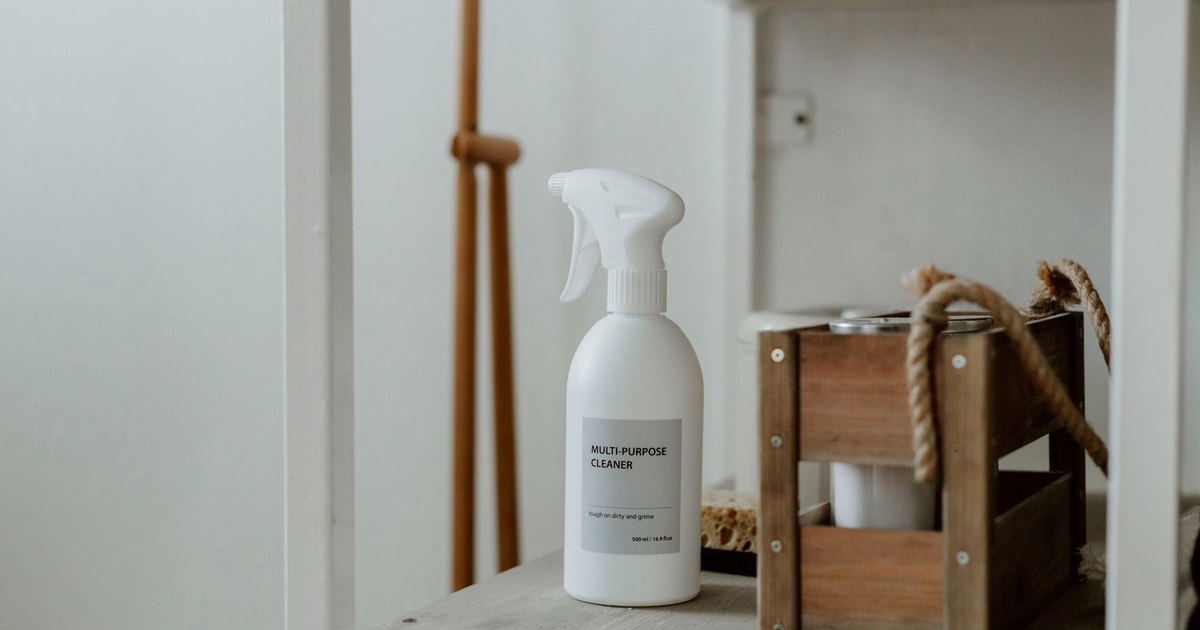 A refillable spray bottle of natural cleaner on a shelf