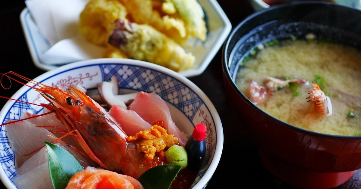 A Japanese meal of miso soup, tempura and sashimi